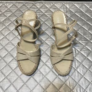 Franco Sarto nude suede open toed snakeskin wedge heel.